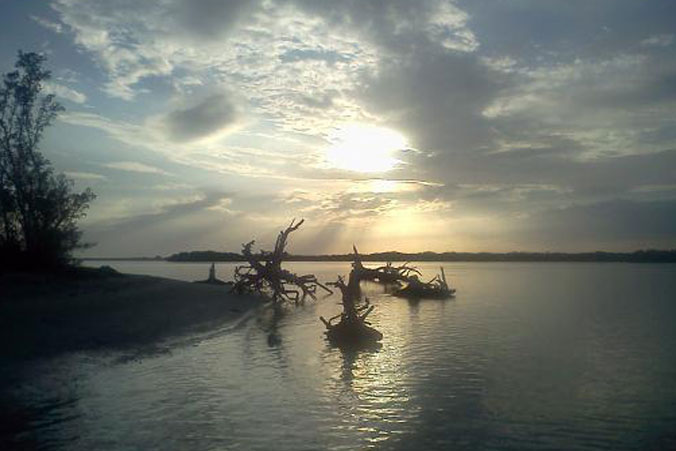 image of dusk over sailboats on bay